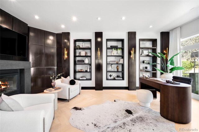 welcome area featuring a large fireplace and recessed lighting