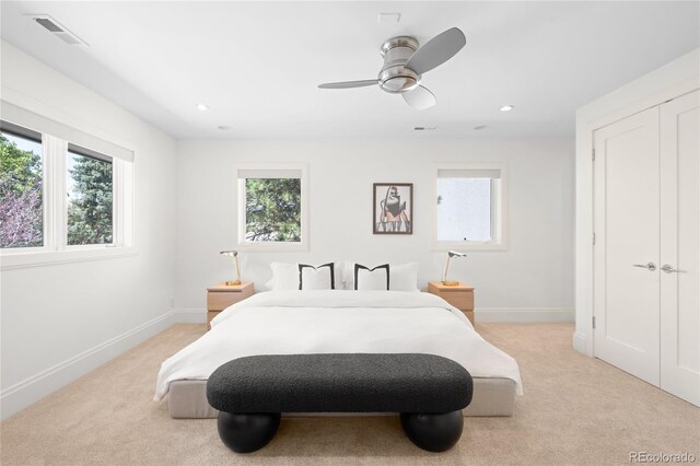 bedroom featuring light colored carpet, baseboards, ceiling fan, and recessed lighting