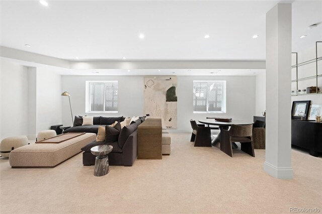 living area featuring carpet and recessed lighting