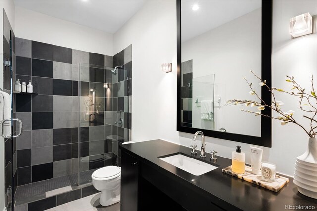 full bath featuring toilet, a stall shower, recessed lighting, and vanity