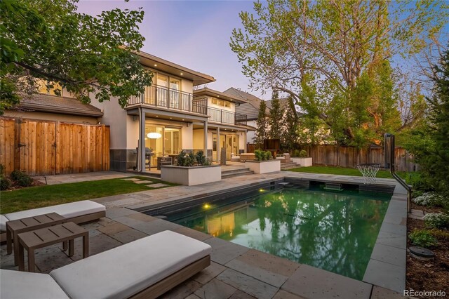 view of pool with a patio and a fenced backyard
