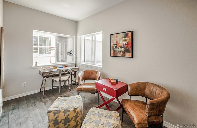 living area with hardwood / wood-style flooring