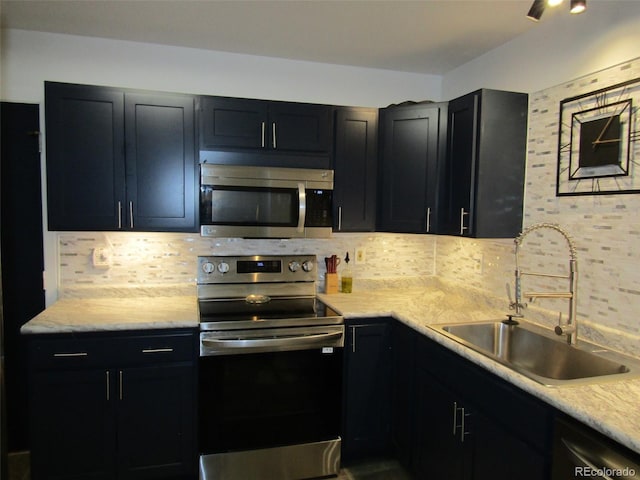 kitchen featuring tasteful backsplash, sink, and stainless steel appliances