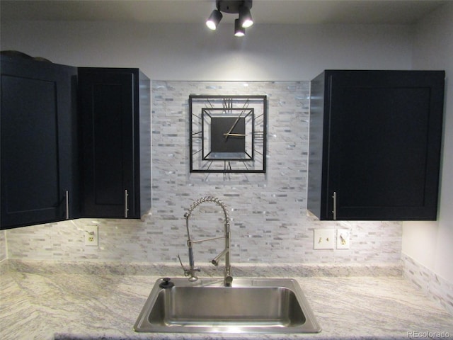 kitchen featuring decorative backsplash and sink