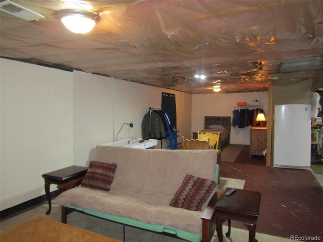 living room featuring concrete flooring