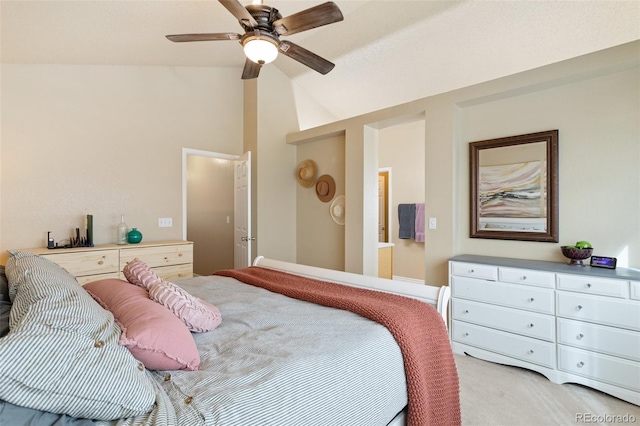 bedroom with light carpet, a ceiling fan, and vaulted ceiling