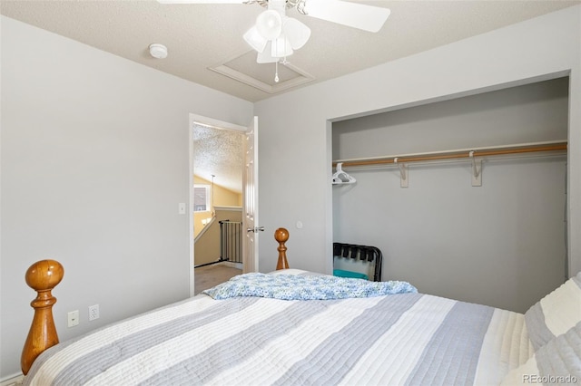 carpeted bedroom featuring a closet, a textured ceiling, and a ceiling fan