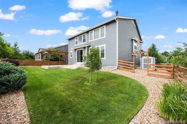 9957 Quintero St, Commerce City, CO 80022 - back of property featuring a storage shed, a fenced backyard, a pergola, and a patio area