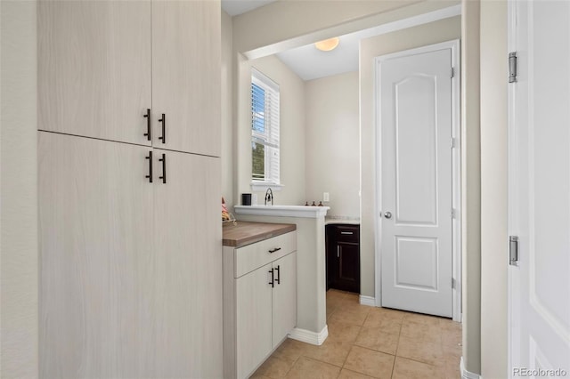 9957 Quintero St, Commerce City, CO 80022 - laundry room featuring light tile patterned flooring and baseboards