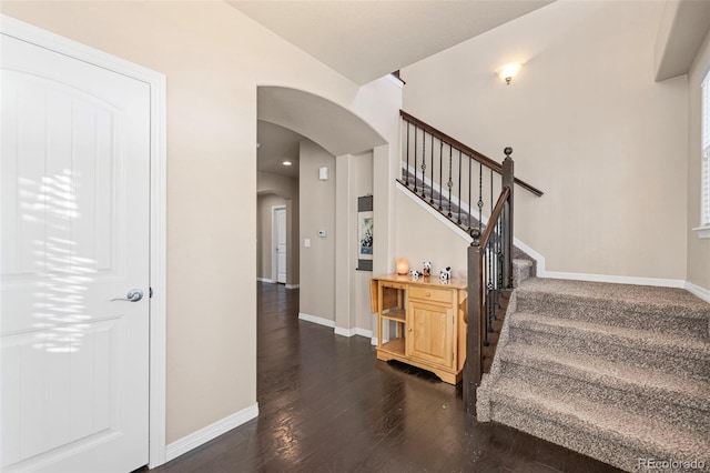 stairway featuring wood-type flooring