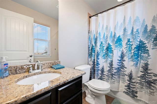 full bathroom with vanity, toilet, and shower / tub combo