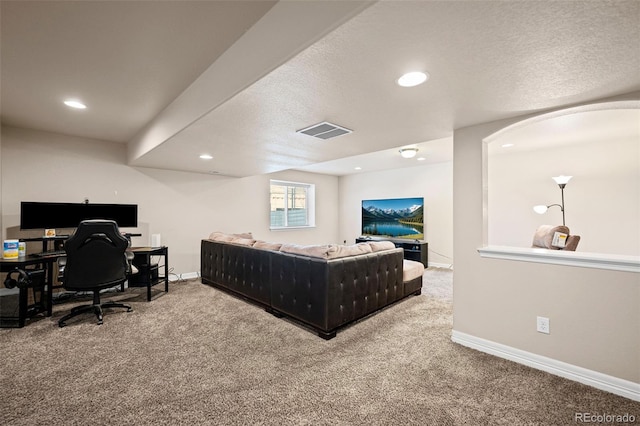 carpeted bedroom featuring a textured ceiling