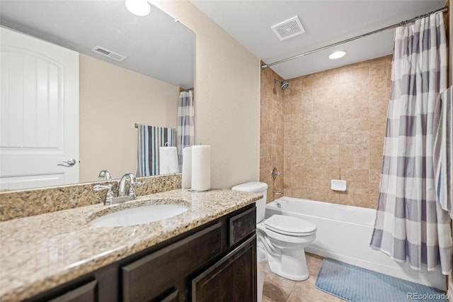 full bathroom featuring shower / bathtub combination with curtain, vanity, tile patterned flooring, and toilet