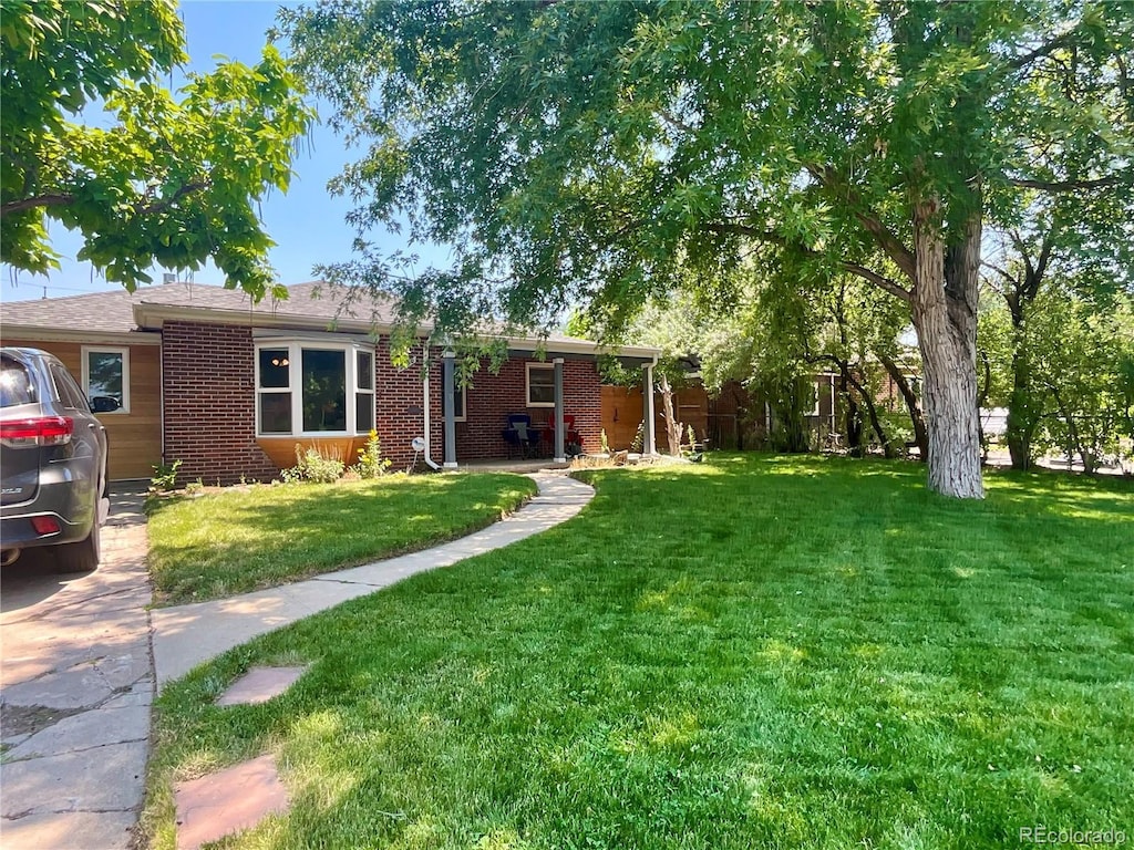 view of front of home with a front yard