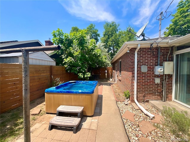 view of patio with a hot tub