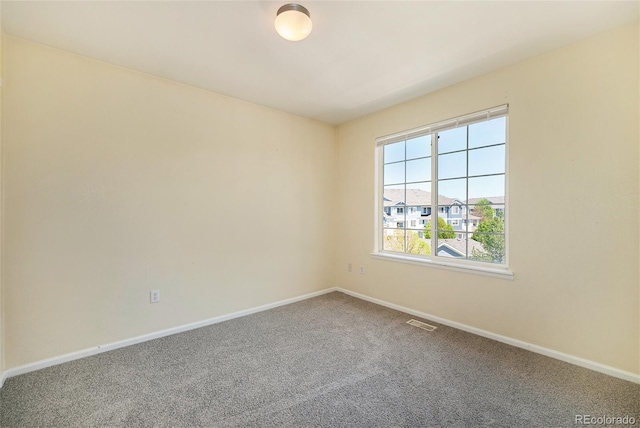 5255 Memphis St Unit 315, Denver, CO 80239 - carpeted spare room featuring baseboards