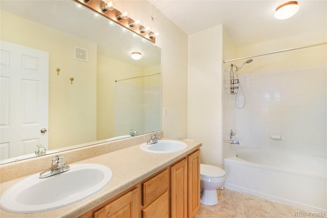 5255 Memphis St Unit 315, Denver, CO 80239 - full bathroom featuring toilet, double vanity, tile patterned flooring, and shower / bathtub combination