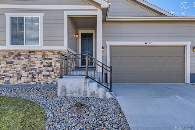 view of exterior entry with a garage