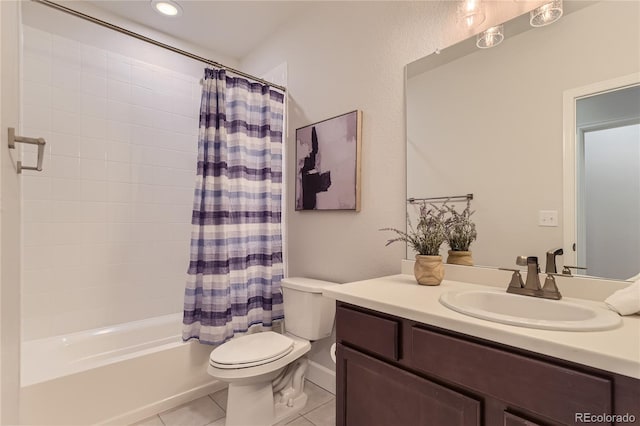 full bathroom with vanity, shower / tub combo with curtain, tile patterned floors, and toilet