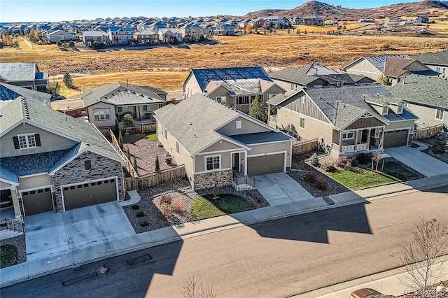 birds eye view of property featuring a mountain view