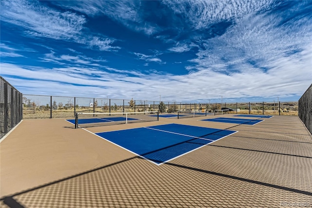 view of sport court with basketball hoop