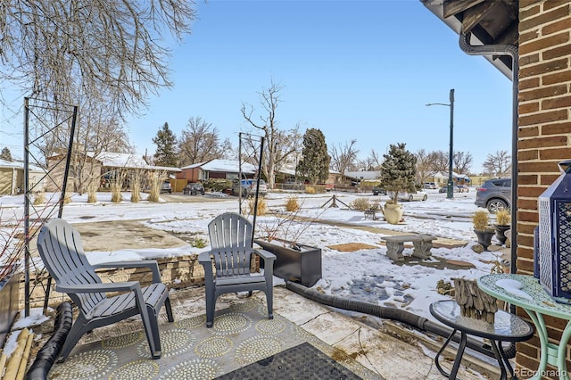 view of snow covered patio