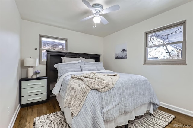 bedroom with dark wood-type flooring and ceiling fan