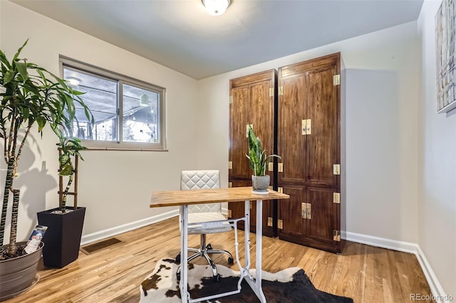 office space with light hardwood / wood-style floors