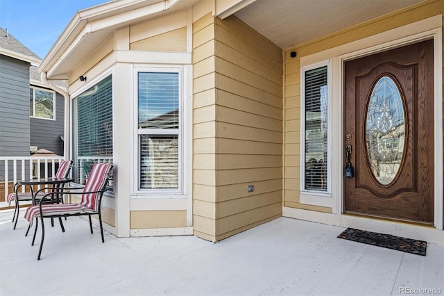 property entrance with covered porch