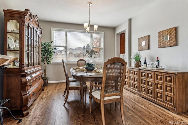 dining room featuring an inviting chandelier and hardwood / wood-style floors