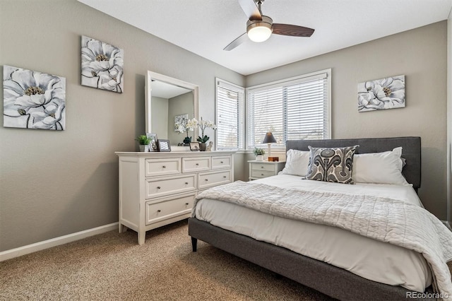 bedroom featuring ceiling fan and light carpet