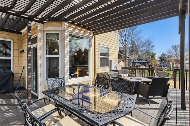 deck featuring area for grilling and a pergola