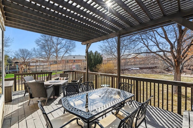 wooden deck with a pergola and a fire pit