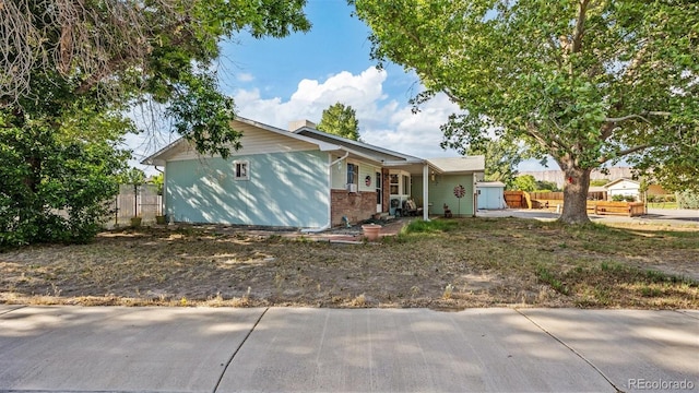 3102 Pine Cone Ct, Grand Junction, CO 81504 - ranch-style home with brick siding and a chimney