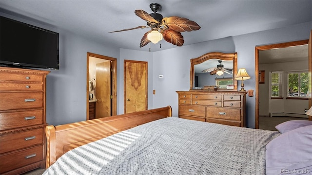 3102 Pine Cone Ct, Grand Junction, CO 81504 - bedroom with a baseboard heating unit and ceiling fan