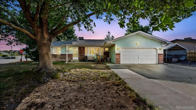 3102 Pine Cone Ct, Grand Junction, CO 81504 - single story home featuring driveway, brick siding, and a garage