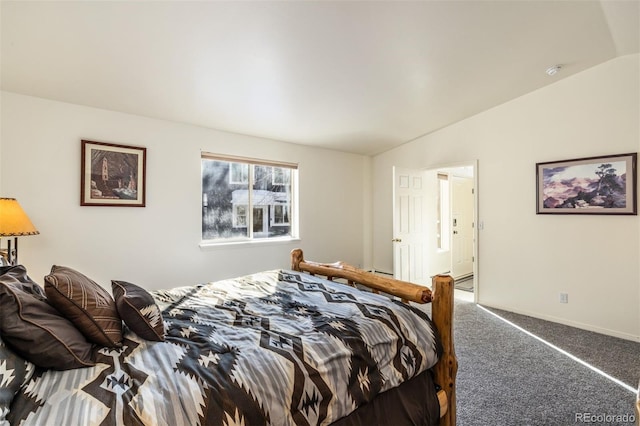 carpeted bedroom featuring vaulted ceiling