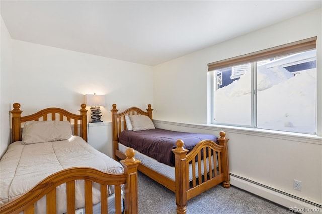 bedroom with a baseboard radiator and light carpet