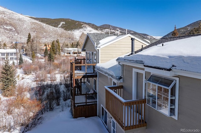 view of snowy exterior featuring a mountain view