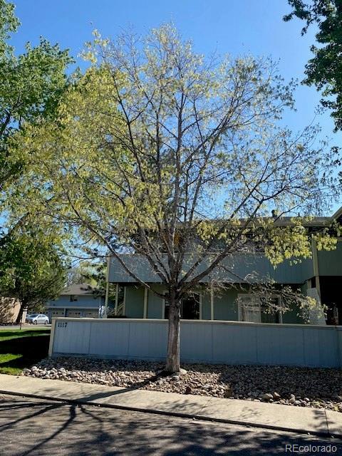 1117 Elysian Field Dr Unit B, Lafayette, CO 80026 - view of front facade featuring a fenced front yard