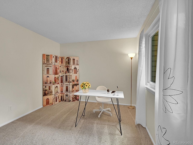 office space featuring carpet floors and a textured ceiling