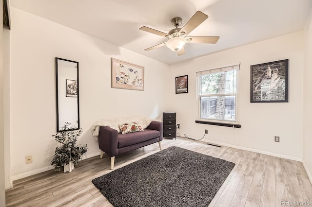 7727 Maroon Peak, Littleton, CO 80127 - sitting room with light wood-style floors and ceiling fan