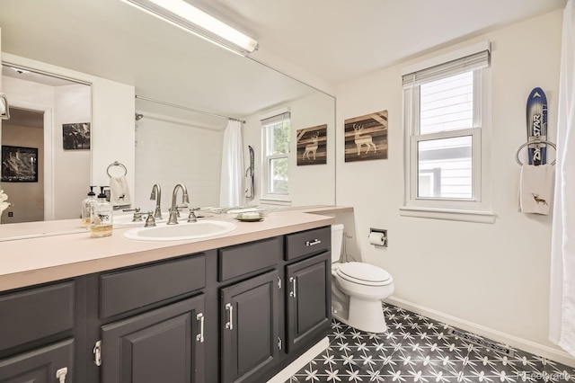 7727 Maroon Peak, Littleton, CO 80127 - full bathroom with tile patterned floors, healthy amount of natural light, vanity, and curtained shower