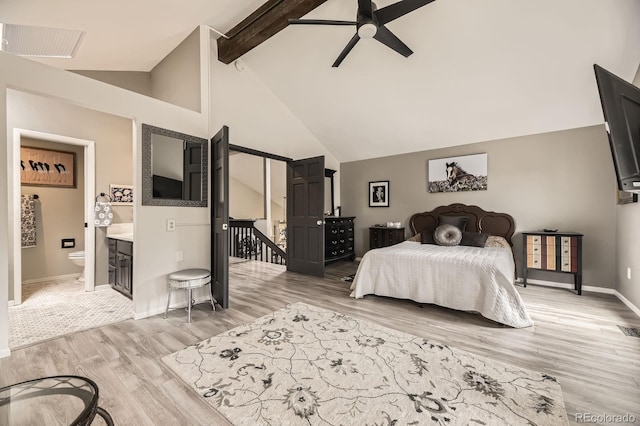 7727 Maroon Peak, Littleton, CO 80127 - bedroom featuring light wood-type flooring, beamed ceiling, high vaulted ceiling, and ensuite bathroom