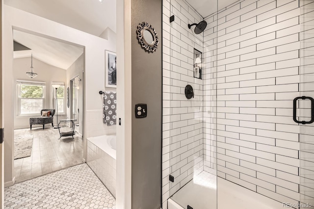 7727 Maroon Peak, Littleton, CO 80127 - bathroom with a shower stall, a bath, lofted ceiling, and tile patterned floors