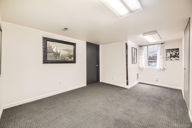 7727 Maroon Peak, Littleton, CO 80127 - spare room featuring dark colored carpet and baseboards