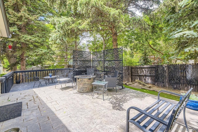 7727 Maroon Peak, Littleton, CO 80127 - view of patio featuring a fire pit
