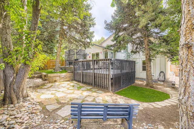 7727 Maroon Peak, Littleton, CO 80127 - fenced backyard with a wooden deck and a patio