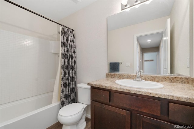 bathroom with toilet, vanity, and shower / bath combo with shower curtain