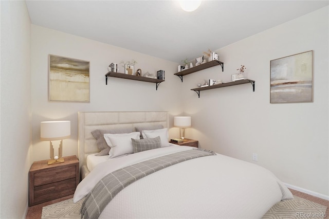 carpeted bedroom with baseboards